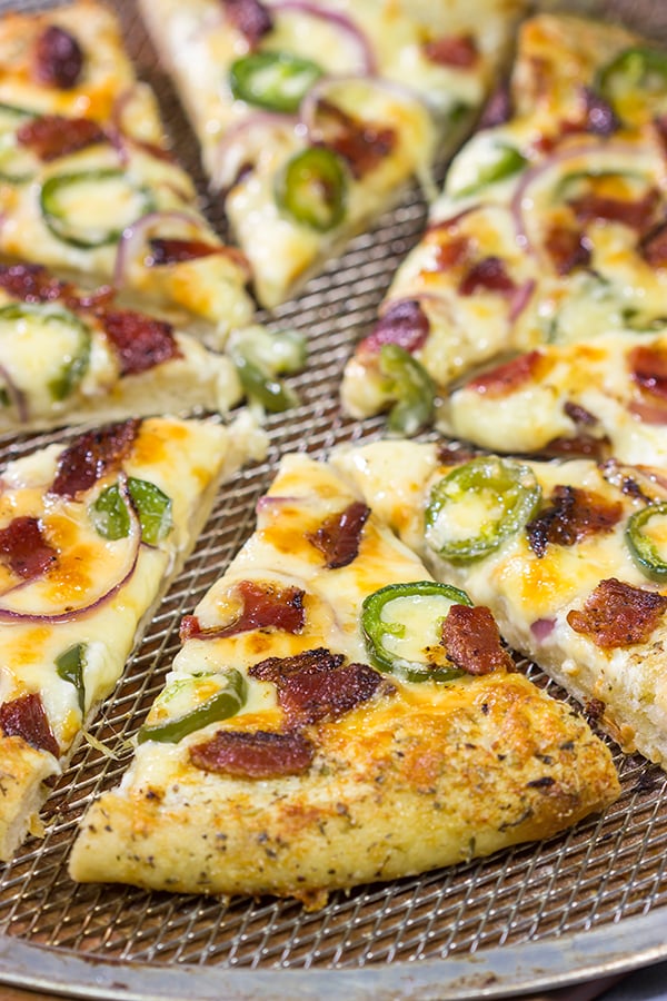 Love jalapeno poppers? Then put this Jalapeno Popper Pizza on the menu! It's a tasty way to mix up Friday night pizza night!