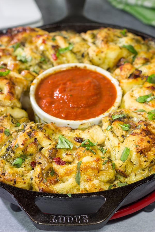 If you're looking for a fun twist on pizza night, then roll up a batch of these Chicken Pesto Pizza Rollups. They're packed with flavor, and they're sure to be a crowd favorite!