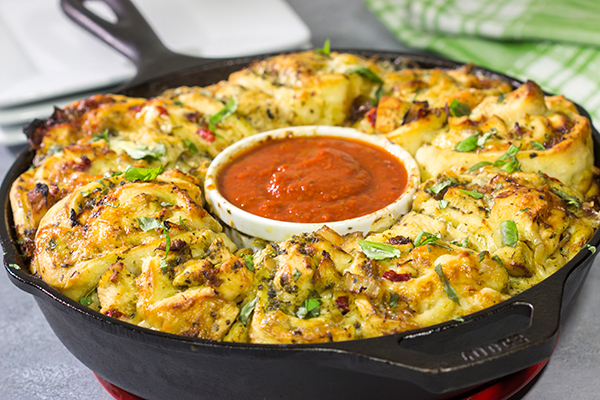 If you're looking for a fun twist on pizza night, then roll up a batch of these Chicken Pesto Pizza Rollups. They're packed with flavor, and they're sure to be a crowd favorite!