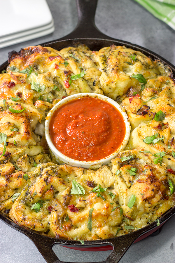 If you're looking for a fun twist on pizza night, then roll up a batch of these Chicken Pesto Pizza Rollups. They're packed with flavor, and they're sure to be a crowd favorite!