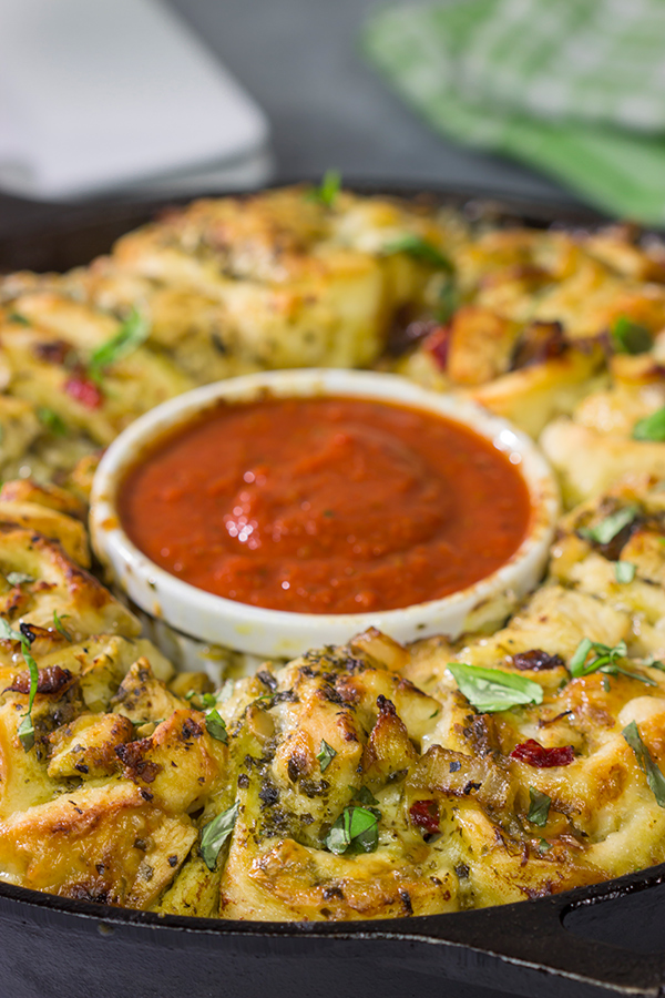 If you're looking for a fun twist on pizza night, then roll up a batch of these Chicken Pesto Pizza Rollups. They're packed with flavor, and they're sure to be a crowd favorite!