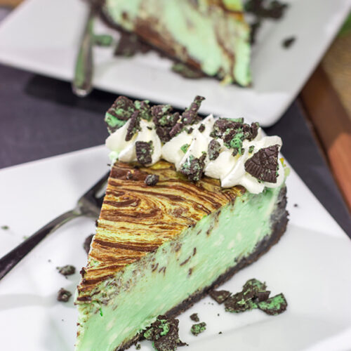 Based on the popular cocktail, this Chocolate Grasshopper Cheesecake features a mint chocolate filling on top of an Oreo crust. It's a delicious and unique dessert!