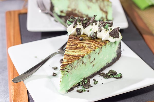 Based on the popular cocktail, this Chocolate Grasshopper Cheesecake features a mint chocolate filling on top of an Oreo crust. It's a delicious and unique dessert!