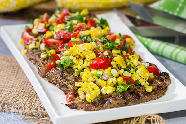 Fire up the grill! This Grilled Flank Steak with Charred Corn Salsa is a great recipe for summer dinners on the back porch!