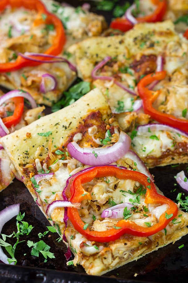 Mix up pizza night with this Tuscan Chicken Pizza! Topped with chicken, red bell peppers and a generous amount of Italian herbs, this pizza makes for a tasty (and easy) meal!