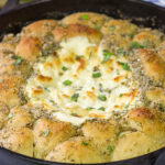 Looking for a tasty and fun appetizer idea? This White Pizza Dip is a creamy, delicious dip...and it's surrounded by warm garlic knots!