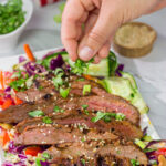Featuring a flavorful, grilled flank steak served over a colorful salad, this Asian Steak Salad is an easy and tasty way to mix up the weeknight dinner routine!