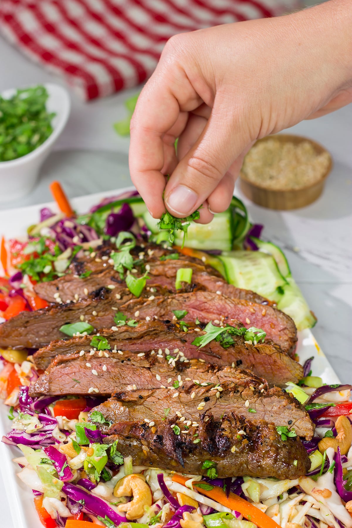 Featuring a flavorful, grilled flank steak served over a colorful salad, this Asian Steak Salad is an easy and tasty way to mix up the weeknight dinner routine!