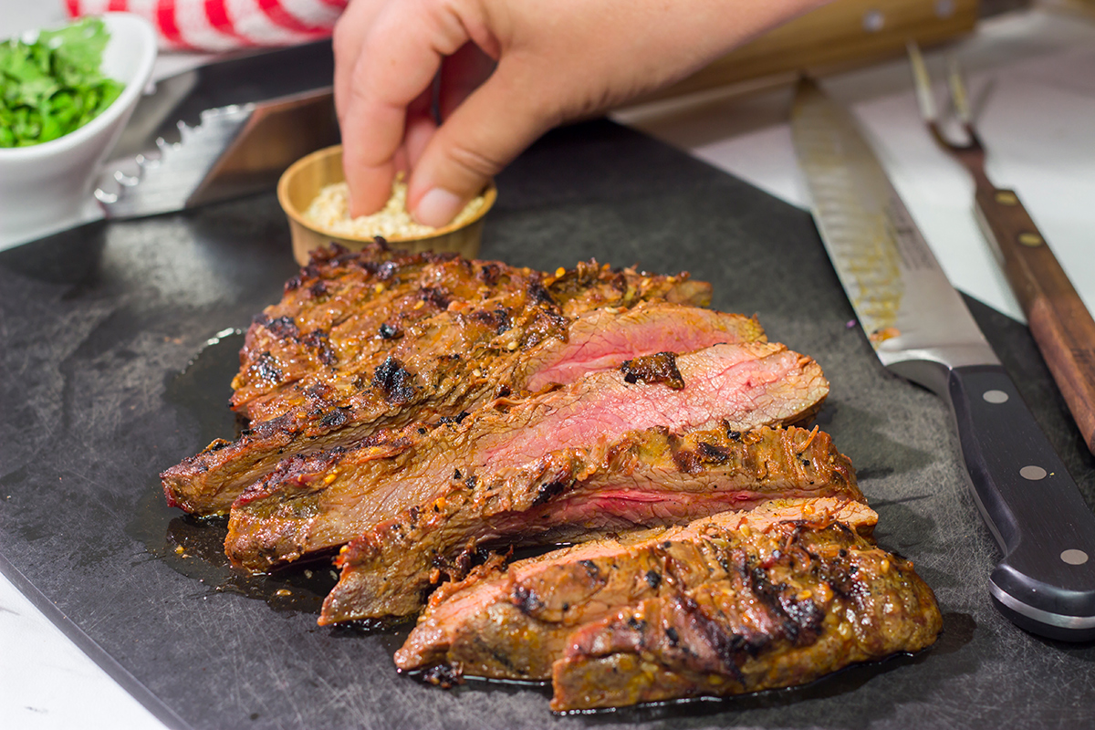 Featuring a flavorful, grilled flank steak served over a colorful salad, this Asian Steak Salad is an easy and tasty way to mix up the weeknight dinner routine!