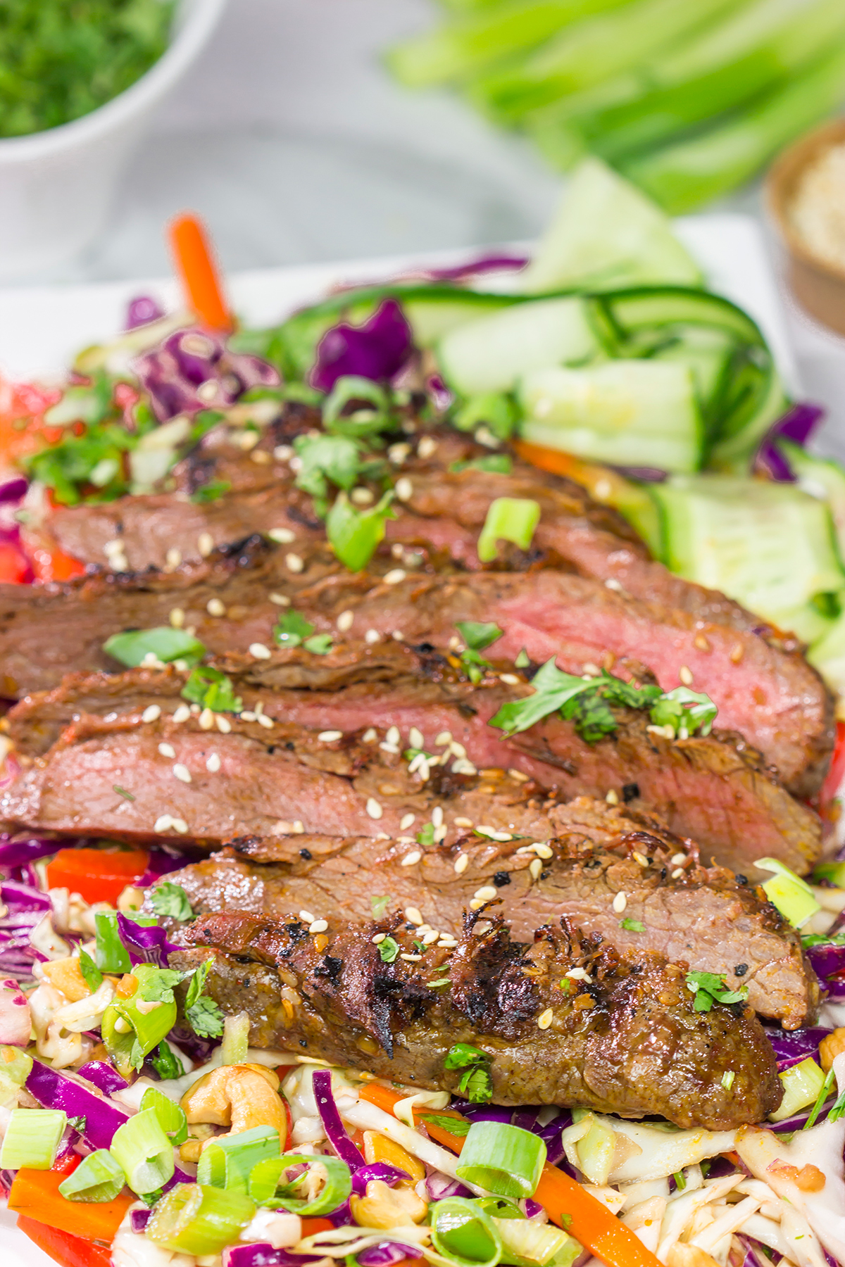 Featuring a flavorful, grilled flank steak served over a colorful salad, this Asian Steak Salad is an easy and tasty way to mix up the weeknight dinner routine!