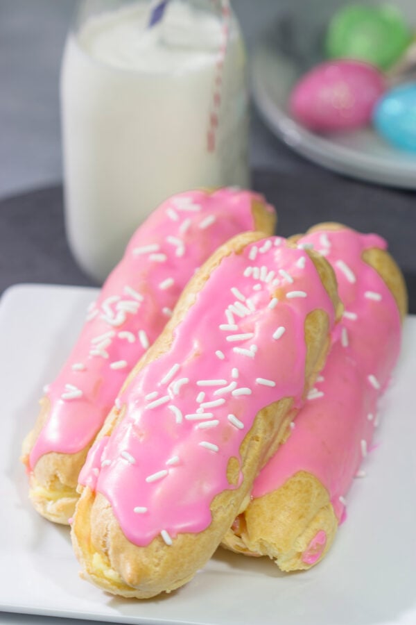 These Easter Eclairs feature a light, crispy shell filled with pastry cream and glazed with pink icing. They're a fun (and tasty!) way to celebrate the season!