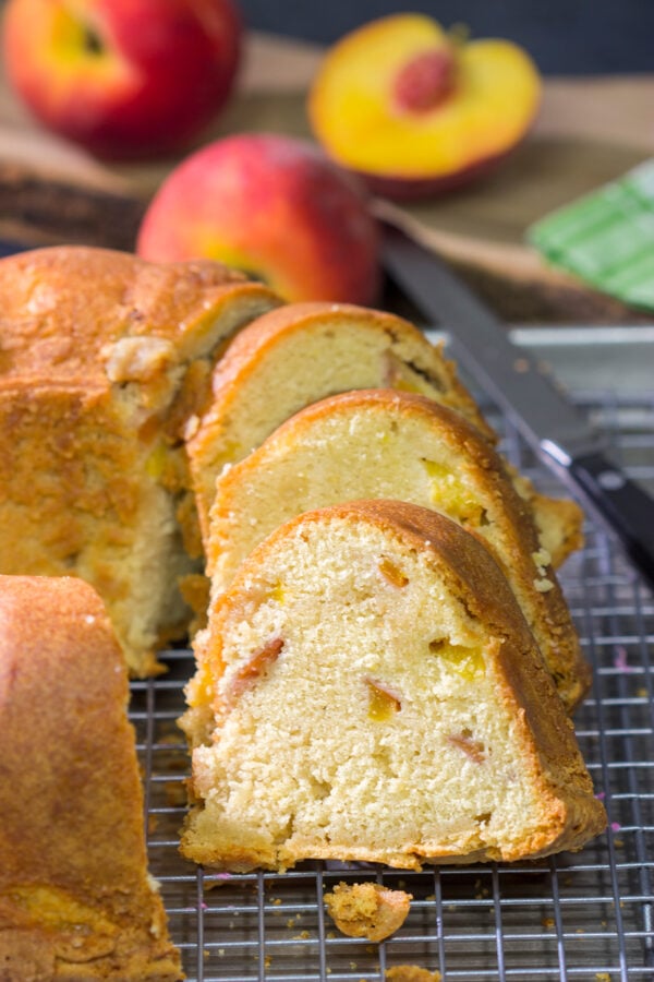 This Fresh Peach Pound Cake is packed with the flavor of summer! Grab a slice and enjoy it on the back porch this weekend!