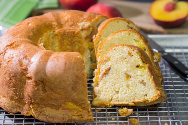 This Fresh Peach Pound Cake is packed with the flavor of summer! Grab a slice and enjoy it on the back porch this weekend!