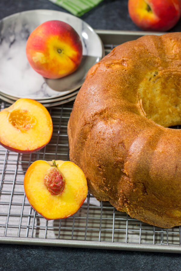 This Fresh Peach Pound Cake is packed with the flavor of summer! Grab a slice and enjoy it on the back porch this weekend!