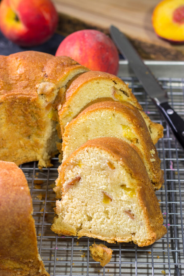 This Fresh Peach Pound Cake is packed with the flavor of summer! Grab a slice and enjoy it on the back porch this weekend!