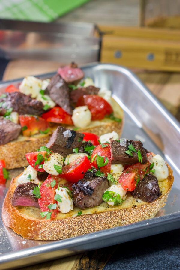 Looking for a fun summer grilling recipe? Grab some steak and tomatoes and whip up a batch of this Grilled Steak and Tomato Crostini!
