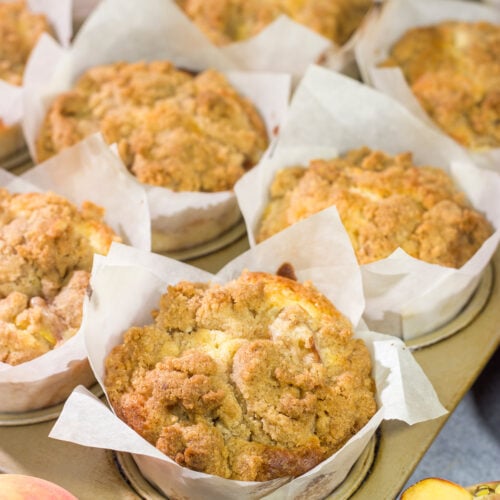 Filled with juicy peaches and topped with a brown sugar crumble, these Peach Streusel Muffins are a tasty treat for summer mornings!