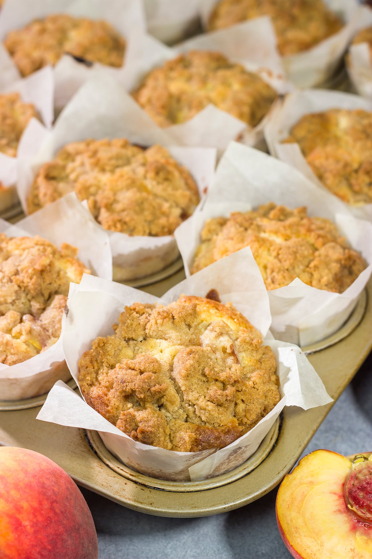 Filled with juicy peaches and topped with a brown sugar crumble, these Peach Streusel Muffins are a tasty treat for summer mornings!