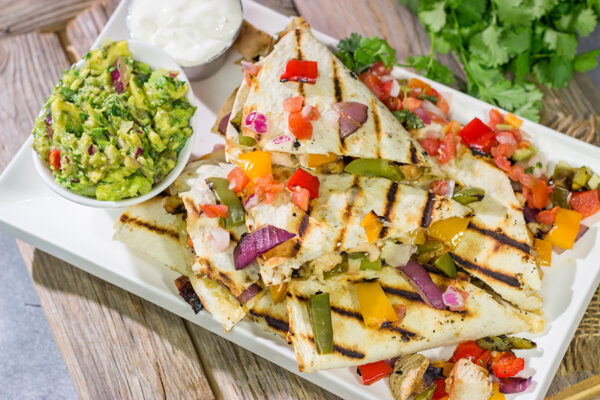 These Pineapple Margarita Chicken Quesadillas are filled with grilled chicken, pineapples, onions and peppers - and the chicken gets marinated in margarita mix for a fun twist!