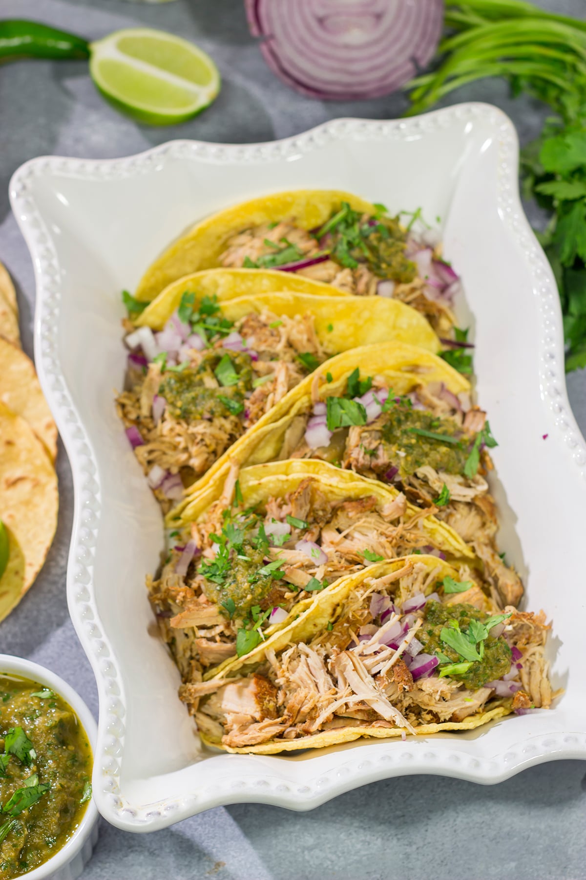 Looking for a good taco recipe? These Slow Cooker Green Chili Tacos are packed with flavor - and they're a real crowd pleaser!