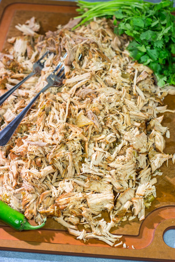 Looking for a good taco recipe? These Slow Cooker Green Chili Tacos are packed with flavor - and they're a real crowd pleaser!