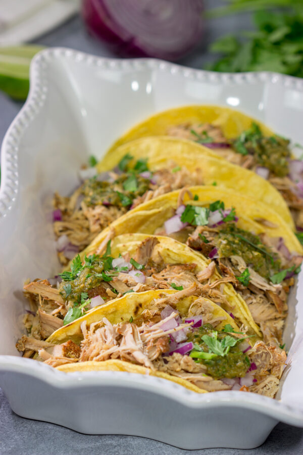 Looking for a good taco recipe? These Slow Cooker Green Chili Tacos are packed with flavor - and they're a real crowd pleaser!