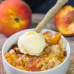 This from-scratch Southern Peach Cobbler recipe features juicy peaches topped with a golden brown, buttery crust. It's the perfect summer dessert!