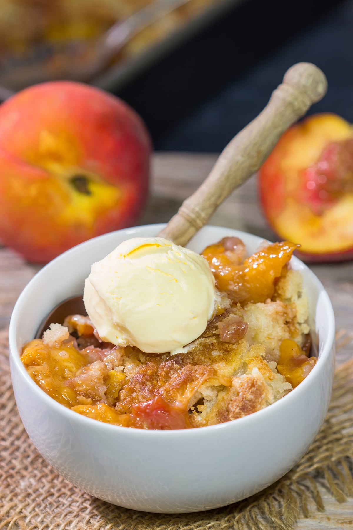 This from-scratch Southern Peach Cobbler recipe features juicy peaches topped with a golden brown, buttery crust. It's the perfect summer dessert!