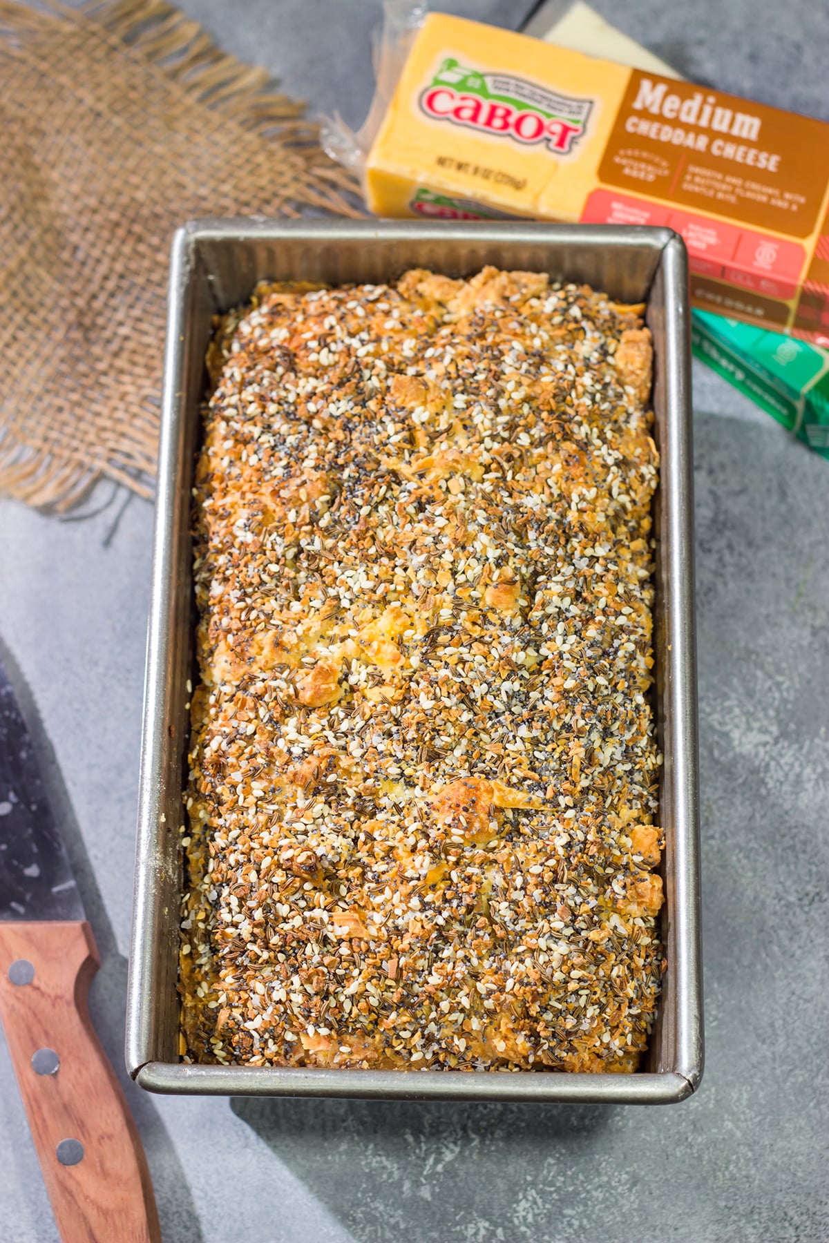 Filled with melted cheese and topped with everything bagel seasoning, this Cheesy Everything Bread is a great way to celebrate the return of baking season!