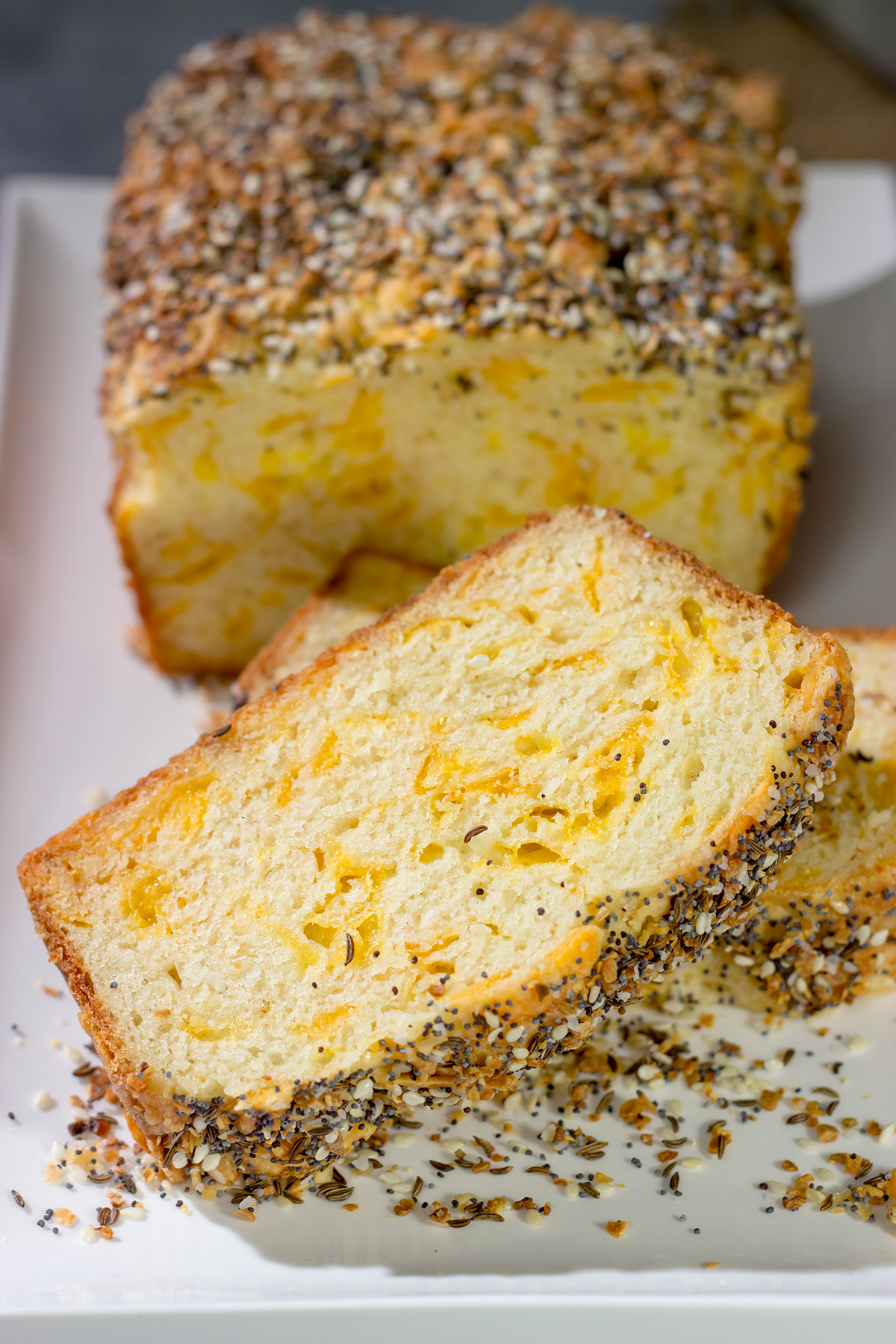 Filled with melted cheese and topped with everything bagel seasoning, this Cheesy Everything Bread is a great way to celebrate the return of baking season!