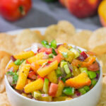 This Fresh Peach Salsa is an easy and delicious summer recipe! Serve it as a dip with chips or as a topping over grilled chicken.