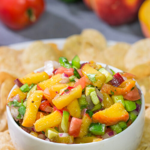 This Fresh Peach Salsa is an easy and delicious summer recipe! Serve it as a dip with chips or as a topping over grilled chicken.
