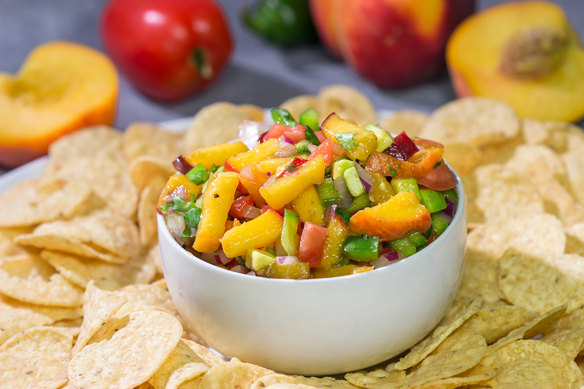 This Fresh Peach Salsa is an easy and delicious summer recipe! Serve it as a dip with chips or as a topping over grilled chicken.