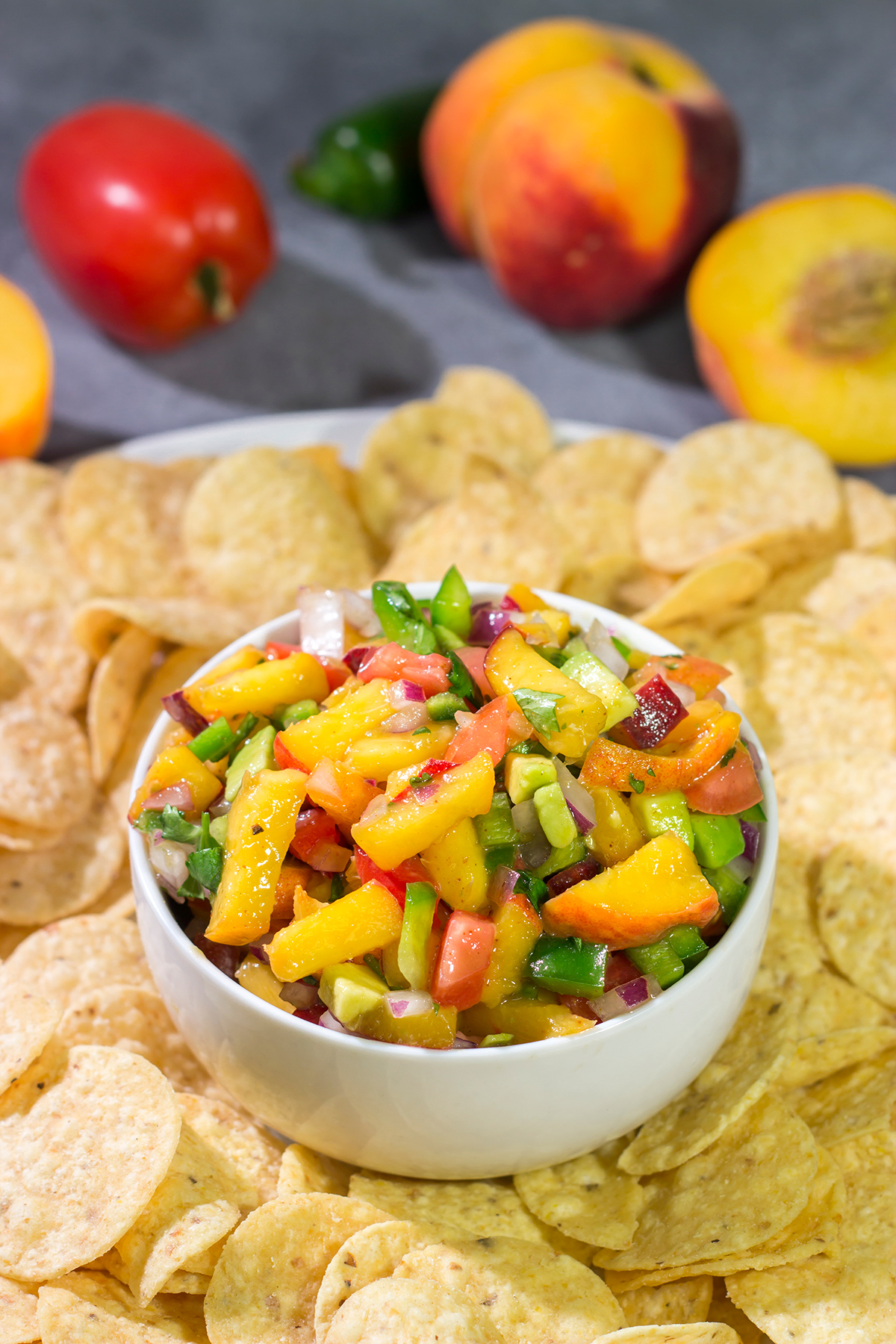 This Fresh Peach Salsa is an easy and delicious summer recipe! Serve it as a dip with chips or as a topping over grilled chicken.