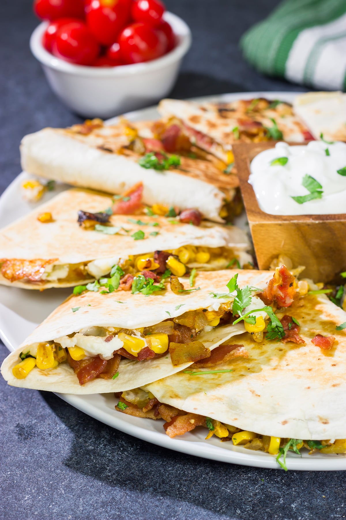 Looking for a fun way to mix up quesadilla night? Put these Goat Cheese and Green Chile Quesadillas on the menu! (Pssst - there's bacon involved!)