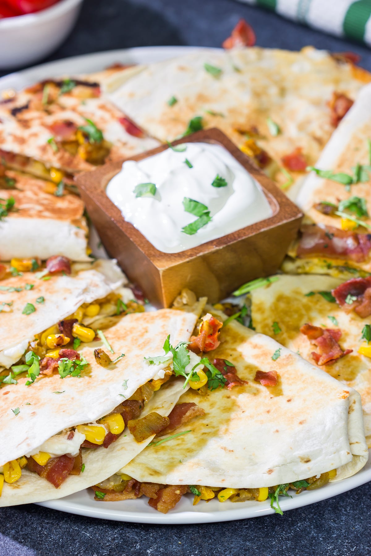 Looking for a fun way to mix up quesadilla night? Put these Goat Cheese and Green Chile Quesadillas on the menu! (Pssst - there's bacon involved!)