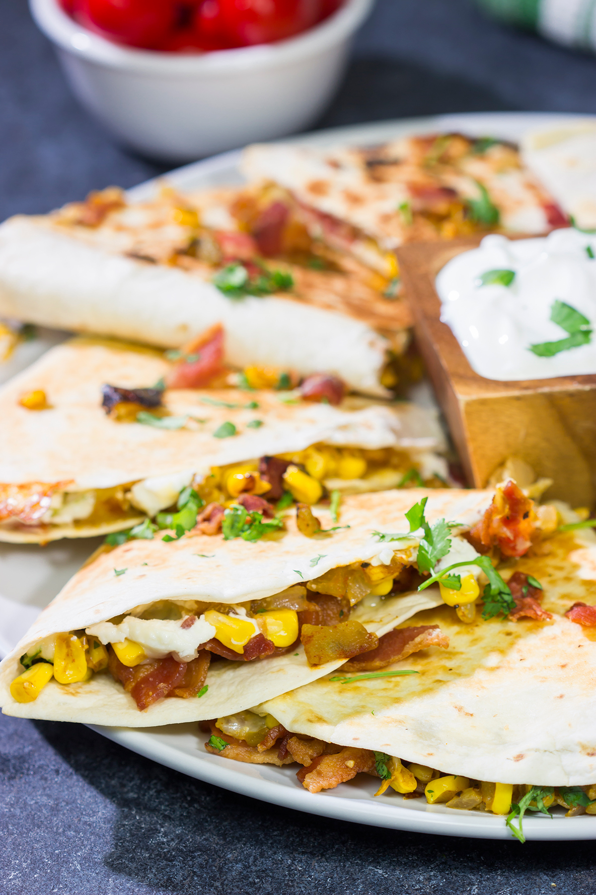 Looking for a fun way to mix up quesadilla night? Put these Goat Cheese and Green Chile Quesadillas on the menu! (Pssst - there's bacon involved!)