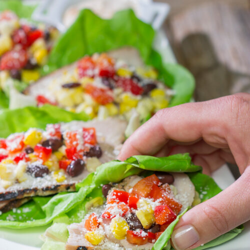 Filled with thinly sliced, marinated pork loin, grilled corn and chopped peppers, these Southwest Pork Lettuce Wraps make for a tasty gameday appetizer or meal!