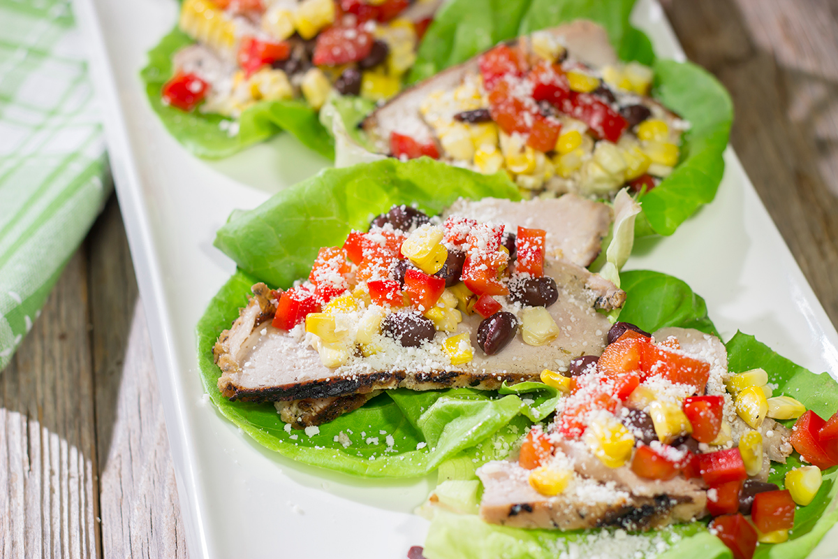 Filled with thinly sliced, marinated pork loin, grilled corn and chopped peppers, these Southwest Pork Lettuce Wraps make for a tasty gameday appetizer or meal!