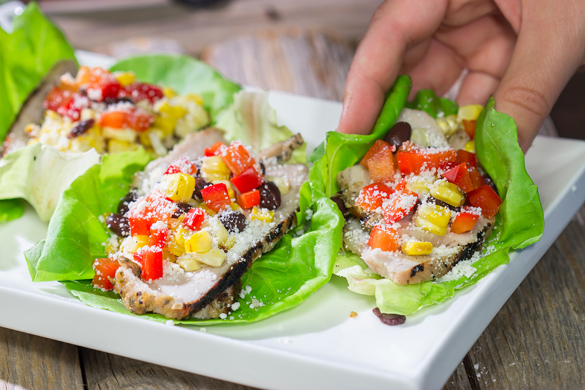 Filled with thinly sliced, marinated pork loin, grilled corn and chopped peppers, these Southwest Pork Lettuce Wraps make for a tasty gameday appetizer or meal!