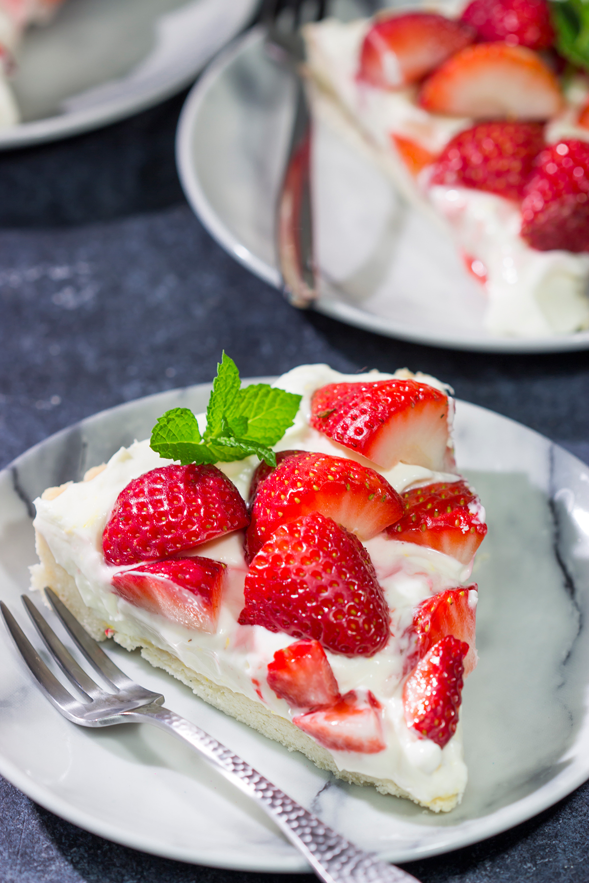 Featuring a creamy cheesecake filling over a shortbread cookie crust, this Strawberry Cheesecake Tart is a great way to highlight the flavor of fresh, juicy strawberries!
