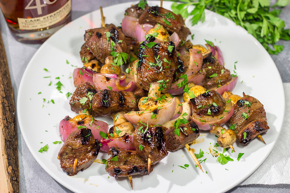 These Bourbon Steak Kabobs feature marinated sirloin steak, mushrooms and red onions on skewers. The grilled flavor of these kabobs is fantastic!