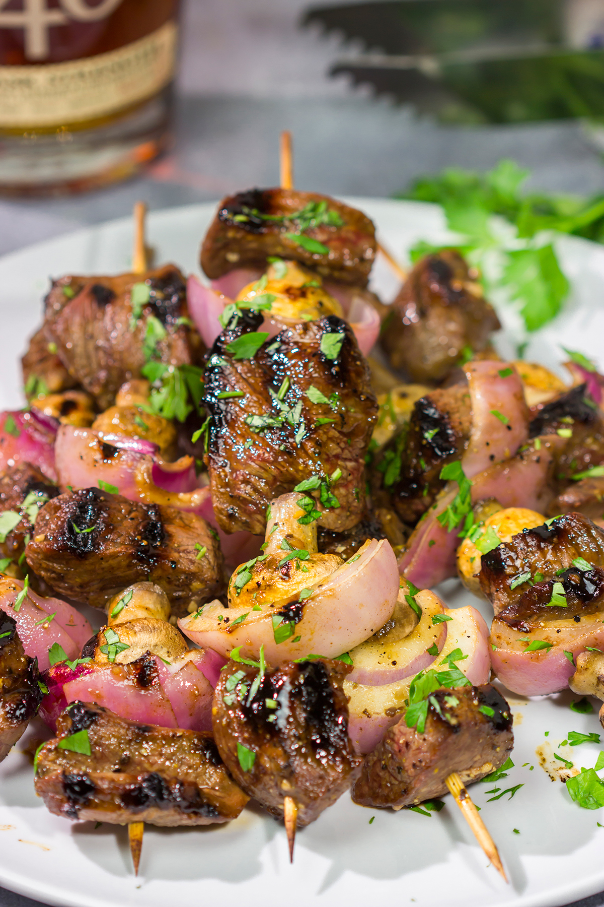 These Bourbon Steak Kabobs feature marinated sirloin steak, mushrooms and red onions on skewers. The grilled flavor of these kabobs is fantastic!