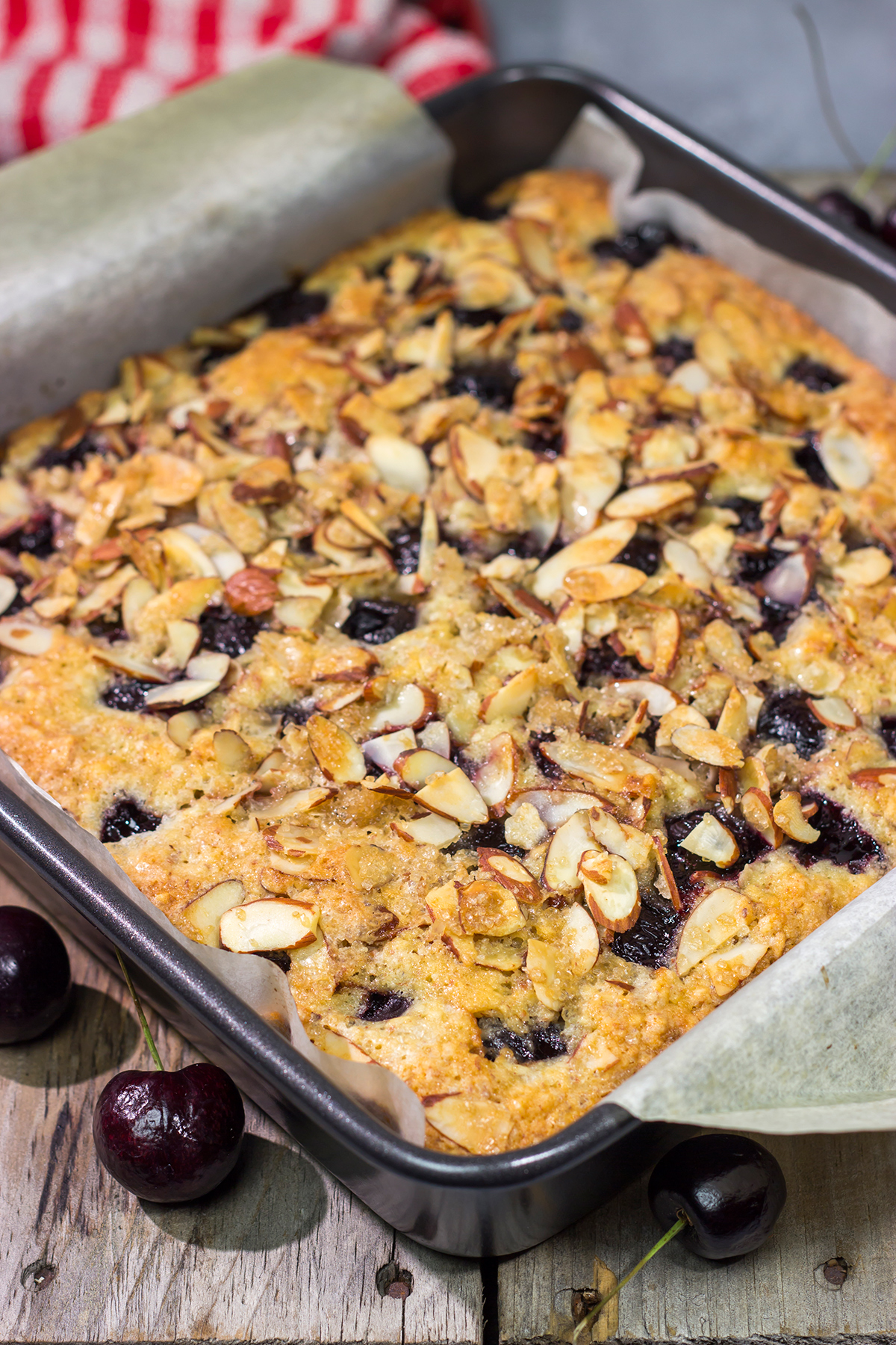 Packed with cherries and topped with a layer of crunchy almonds, this Cherry Almond Cake makes for one heck of a dessert...or breakfast!