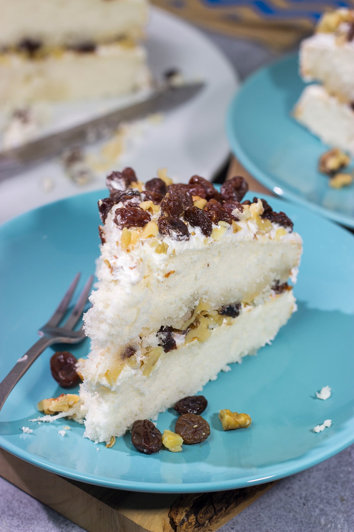 A Lady Baltimore Cake features white cake topped with 2 frostings, toasted walnuts and sherry-soaked raisins. It's truly a unique dessert!