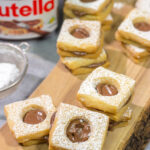 These Nutella Cookies feature buttery shortbread cookies with a schmear of Nutella in between. Good luck eating just one!