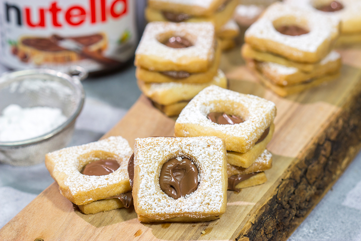 These Nutella Cookies feature buttery shortbread cookies with a schmear of Nutella in between. Good luck eating just one!