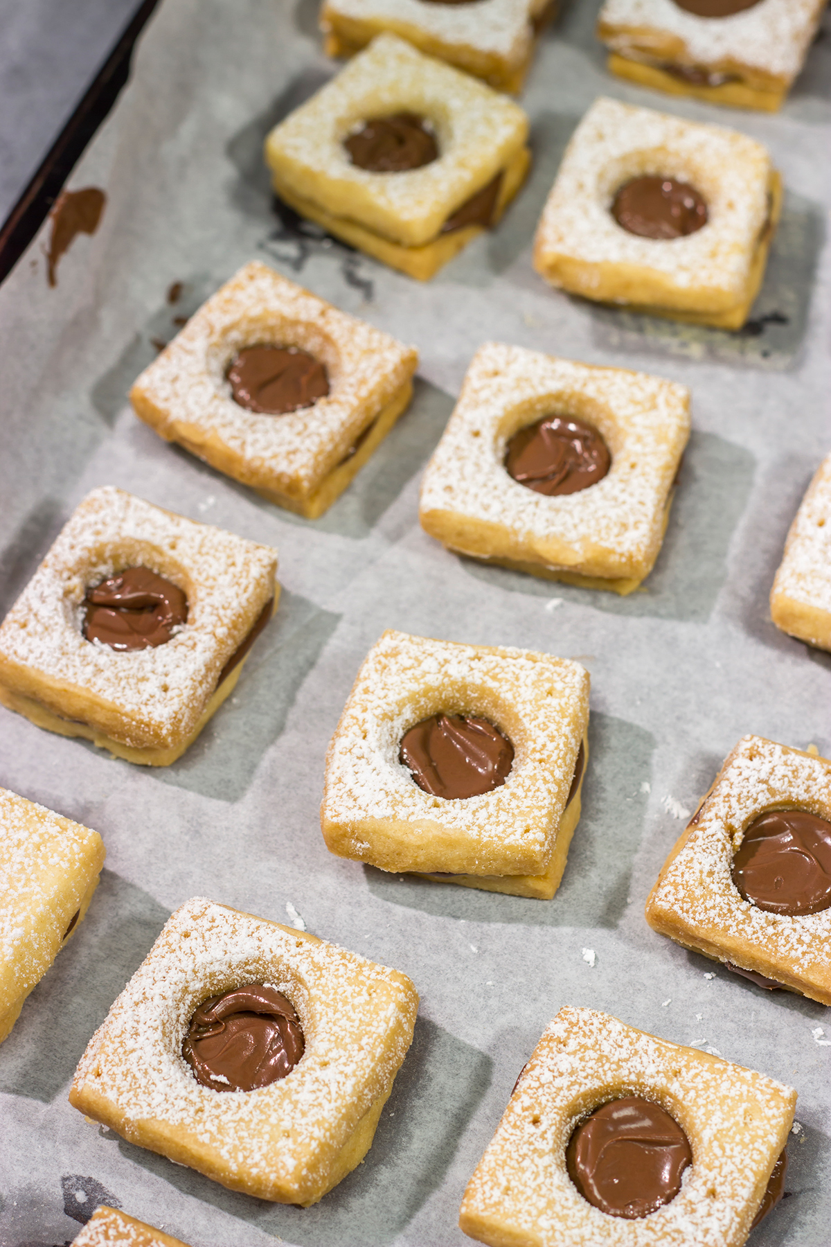 These Nutella Cookies feature buttery shortbread cookies with a schmear of Nutella in between. Good luck eating just one!