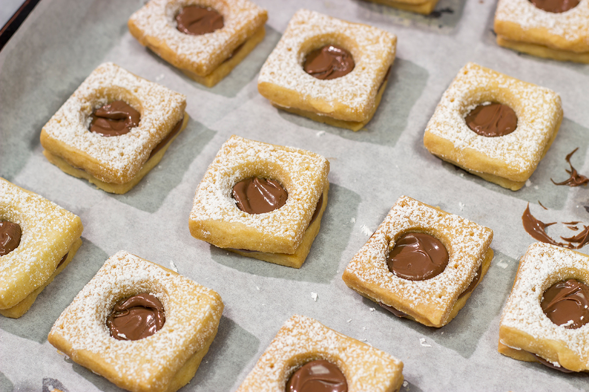 These Nutella Cookies feature buttery shortbread cookies with a schmear of Nutella in between. Good luck eating just one!