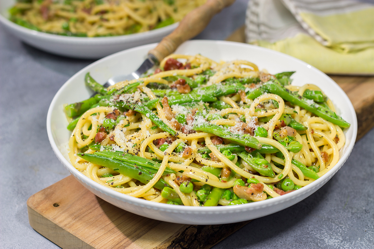 Loaded with spring vegetables tossed in a creamy, cheesy sauce, this Spaghetti Carbonara with Spring Vegetables makes for a delicious comfort food meal!